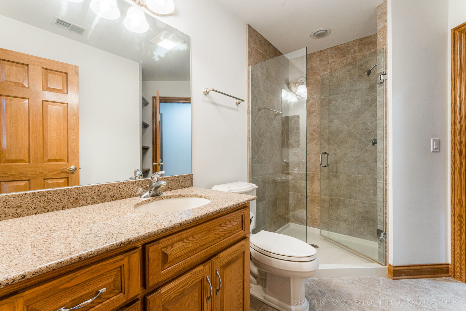 23374 West Milton Road Wauconda, IL 60084 - Photo 37 of 49 a bathroom with a sink a toilet and shower