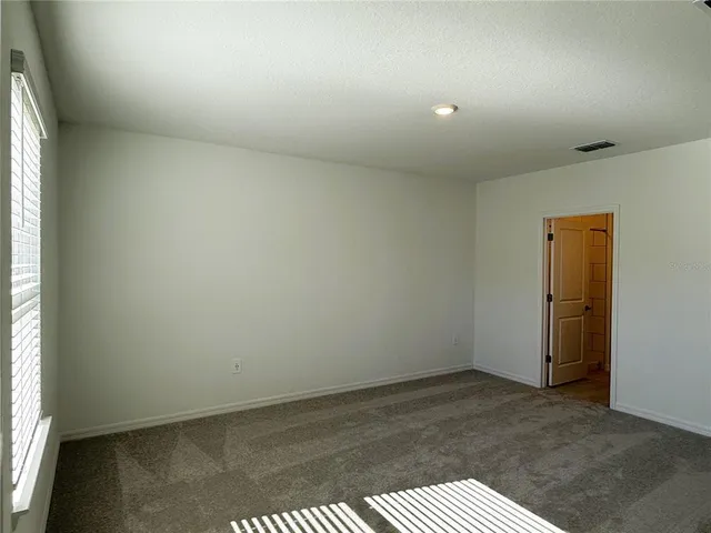 an empty room with a bench