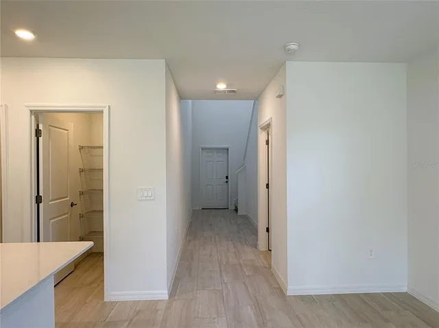 a view of a sink and a refrigerator in a bathroom