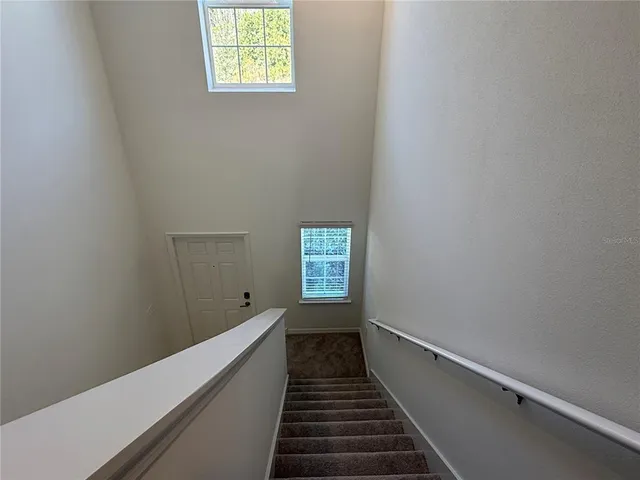 a view of a hallway with a room