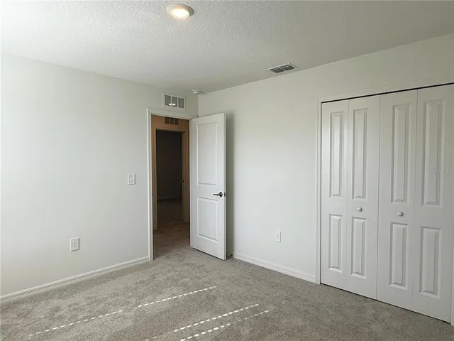 a bathroom with a double vanity sink mirror double and bathtub
