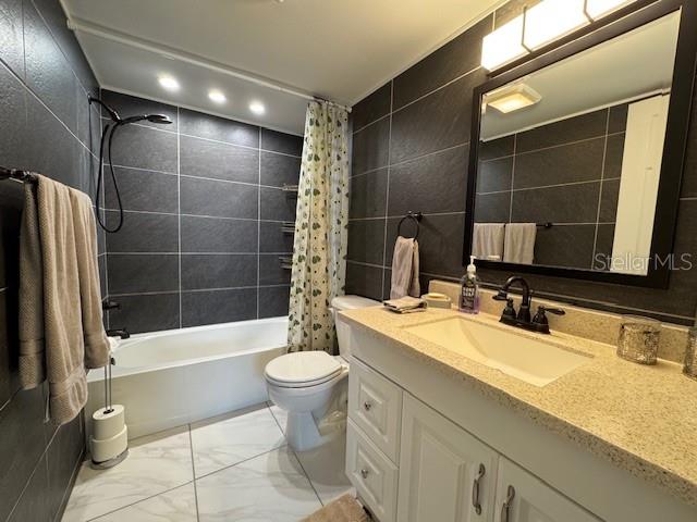 11485 Oakhurst Road, Unit 319 Largo, FL 33774 - Photo 11 of 63 a bathroom with a sink a toilet and shower
