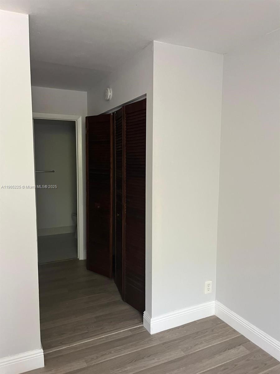 2701 Riverside Drive, Unit 203B Coral Springs, FL 33065 - Photo 11 of 18 a view of hallway with wooden floor