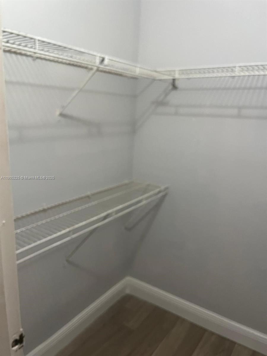 2701 Riverside Drive, Unit 203B Coral Springs, FL 33065 - Photo 13 of 18 a view of a room with racks on the wall