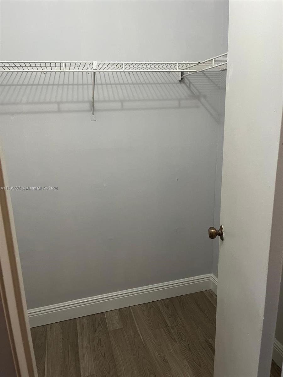 2701 Riverside Drive, Unit 203B Coral Springs, FL 33065 - Photo 14 of 18 a view of small space with racks on the wall