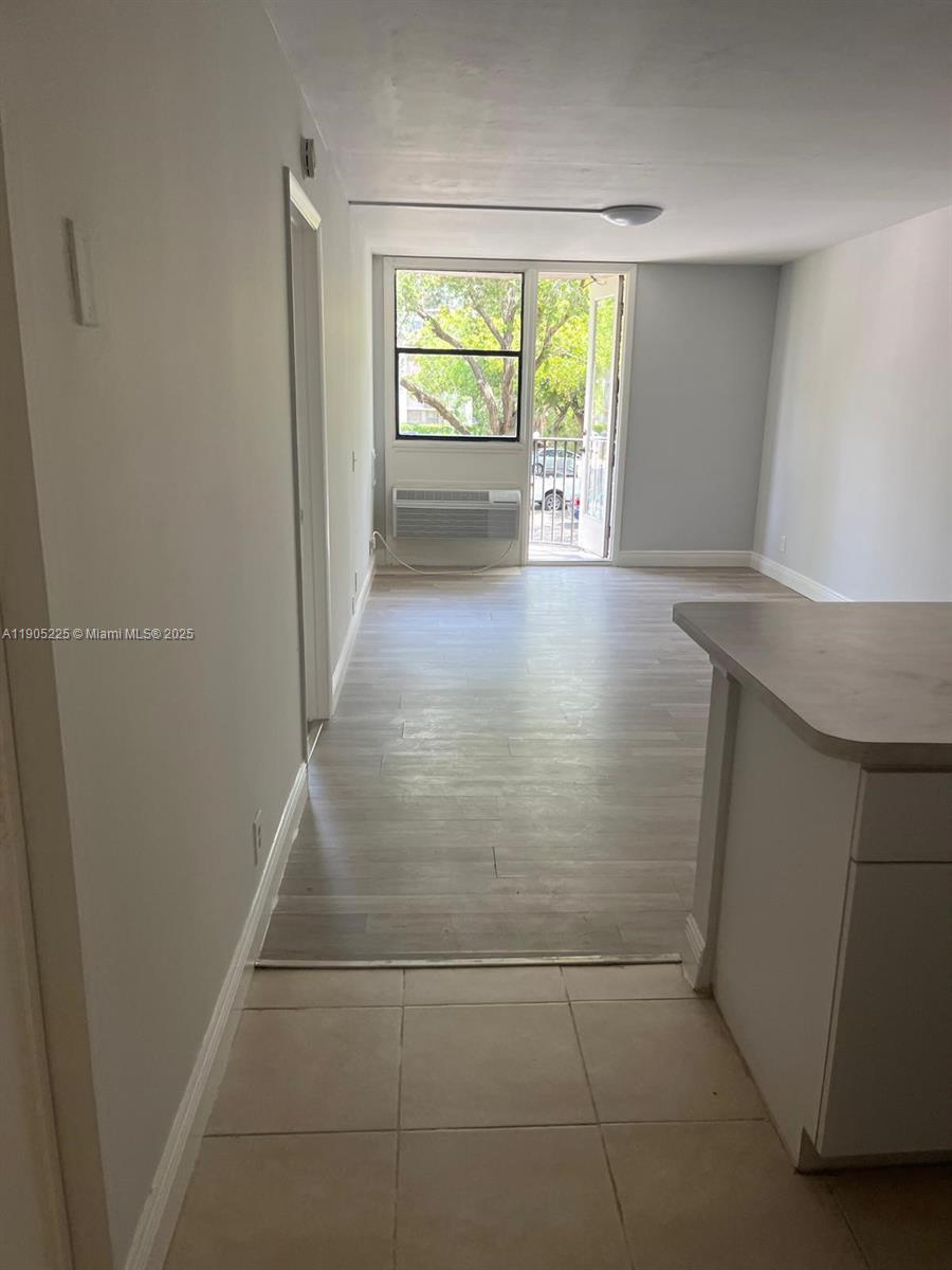 2701 Riverside Drive, Unit 203B Coral Springs, FL 33065 - Photo 4 of 18 a view of hallway with window