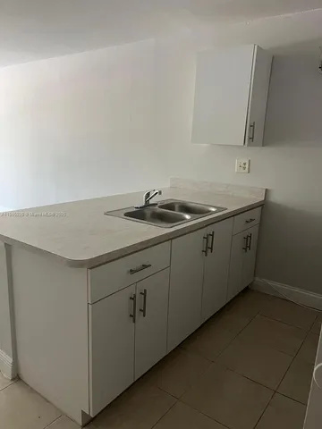 a utility room with sink
