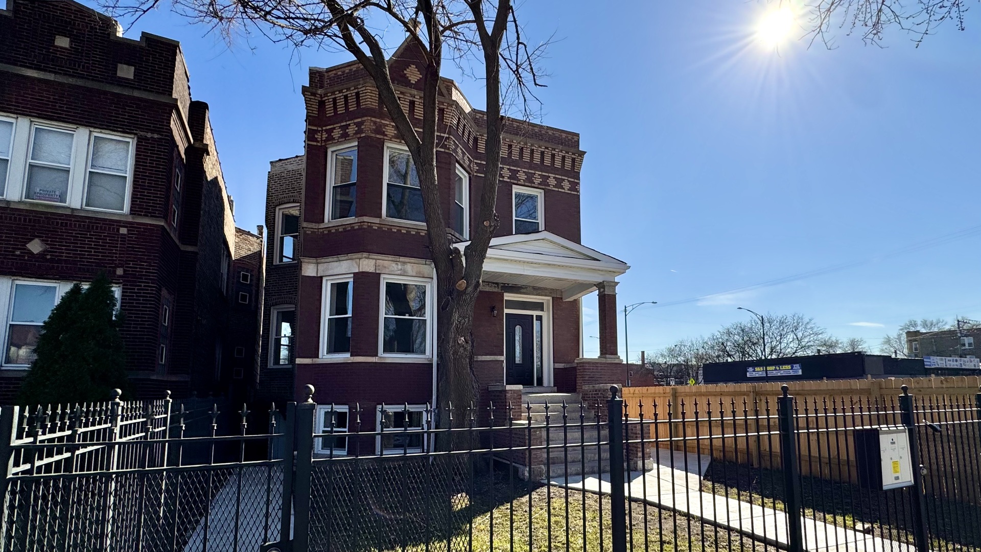 4751 West Monroe Street Chicago, IL 60644 - Photo 3 of 22 a front view of a house with glass windows