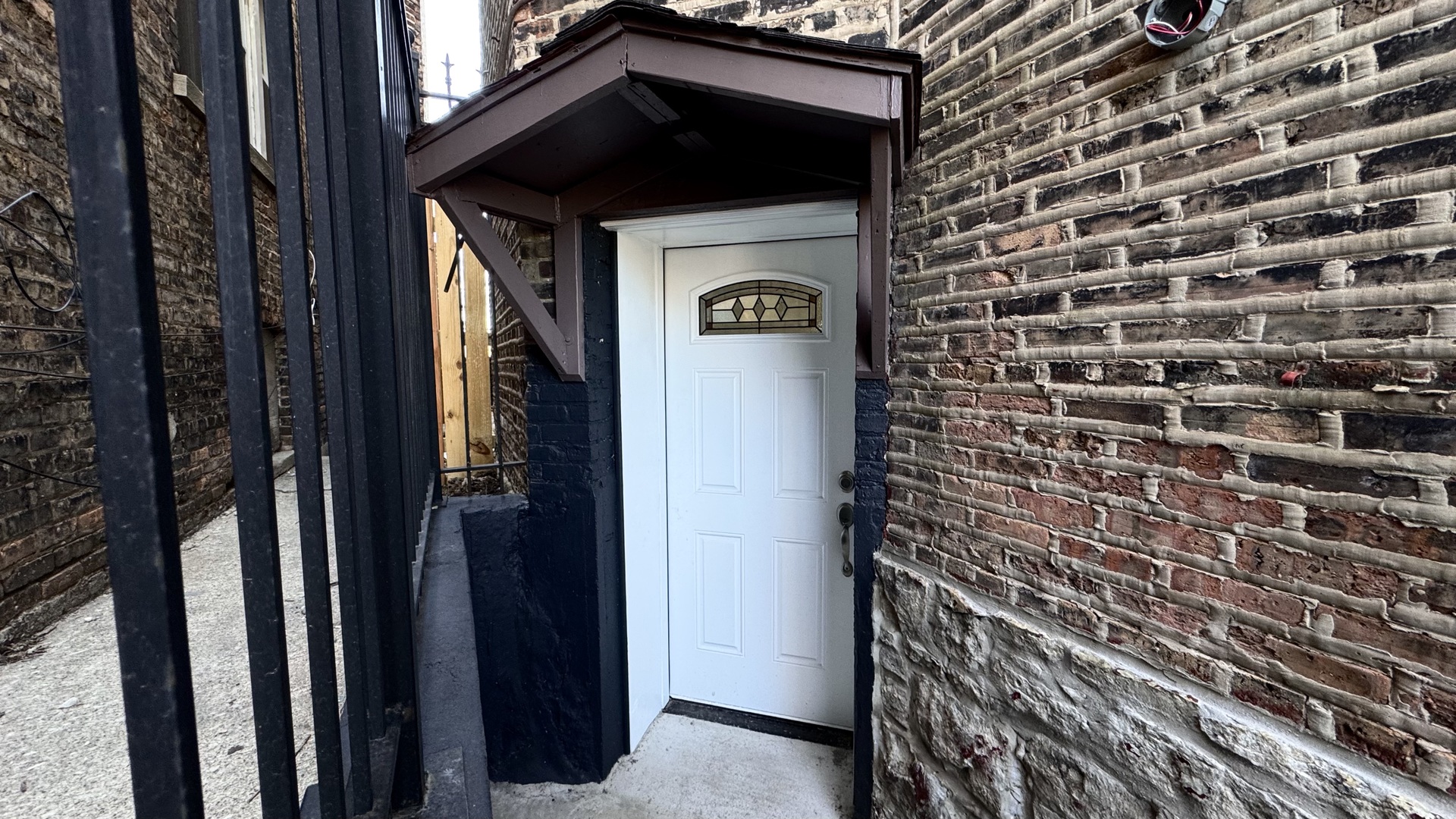 4751 West Monroe Street Chicago, IL 60644 - Photo 5 of 22 a front view of a house with a door