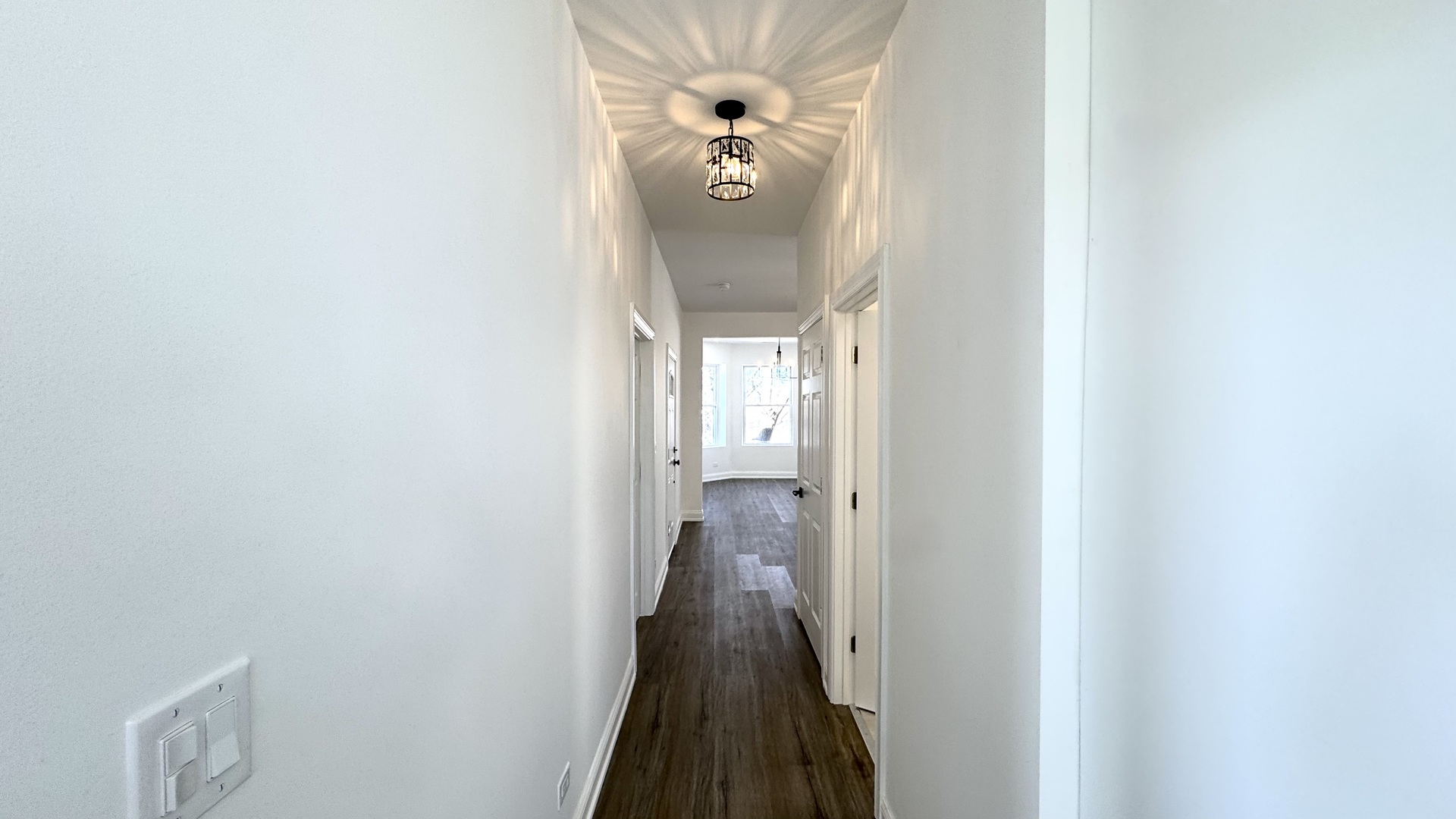 4751 West Monroe Street Chicago, IL 60644 - Photo 9 of 22 a view of a hallway with wooden floor