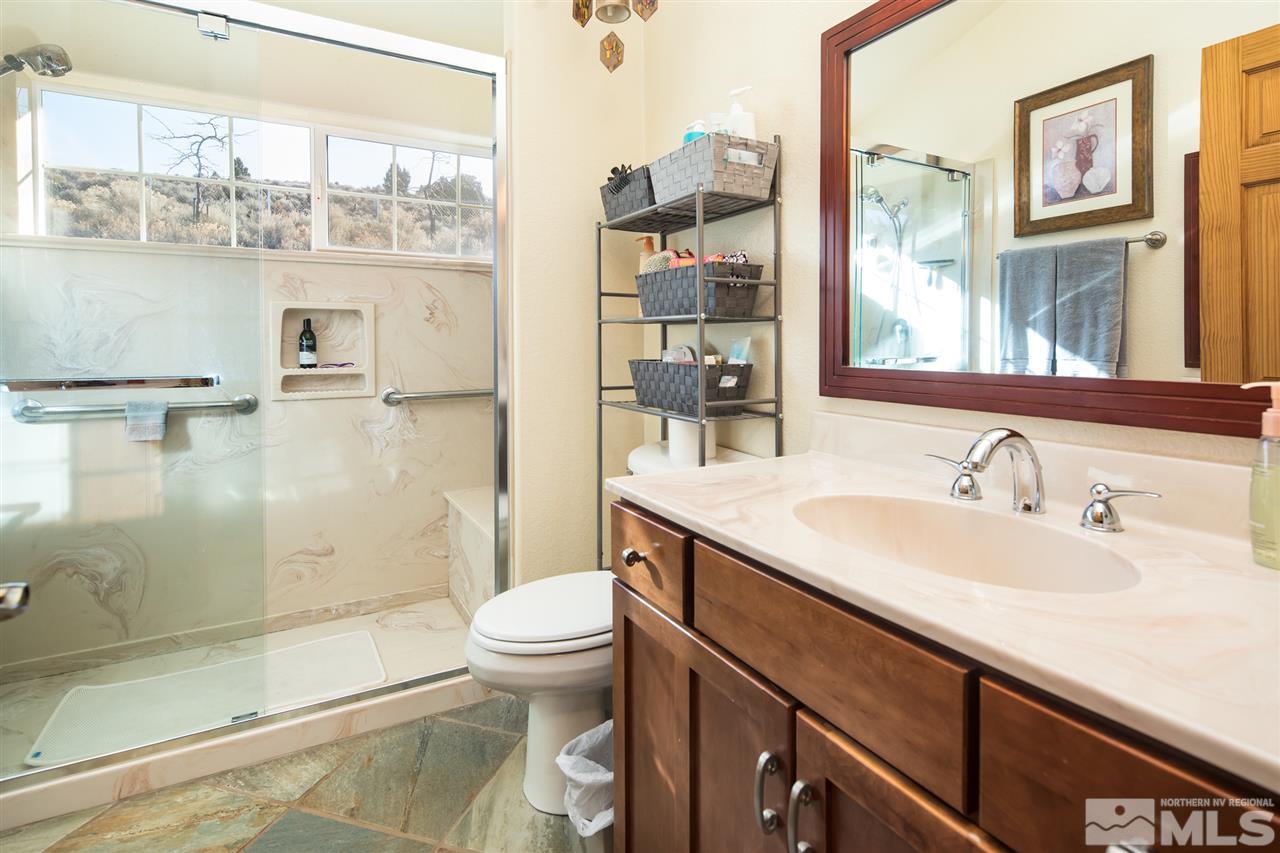 100 Boron Lane Reno, NV 89506 - Photo 11 of 25 a bathroom with a sink a toilet and shower