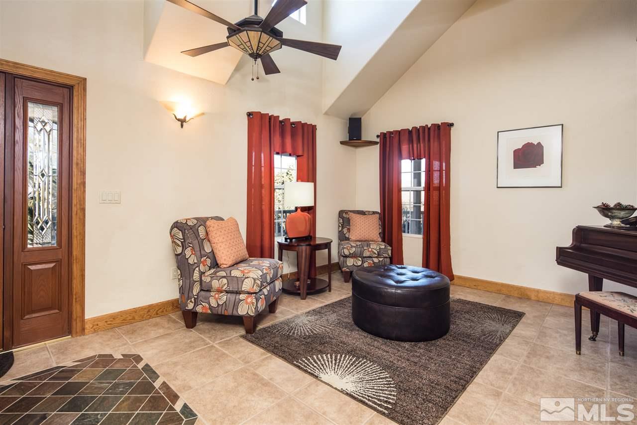 100 Boron Lane Reno, NV 89506 - Photo 3 of 25 a living room with furniture a ceiling fan and a window