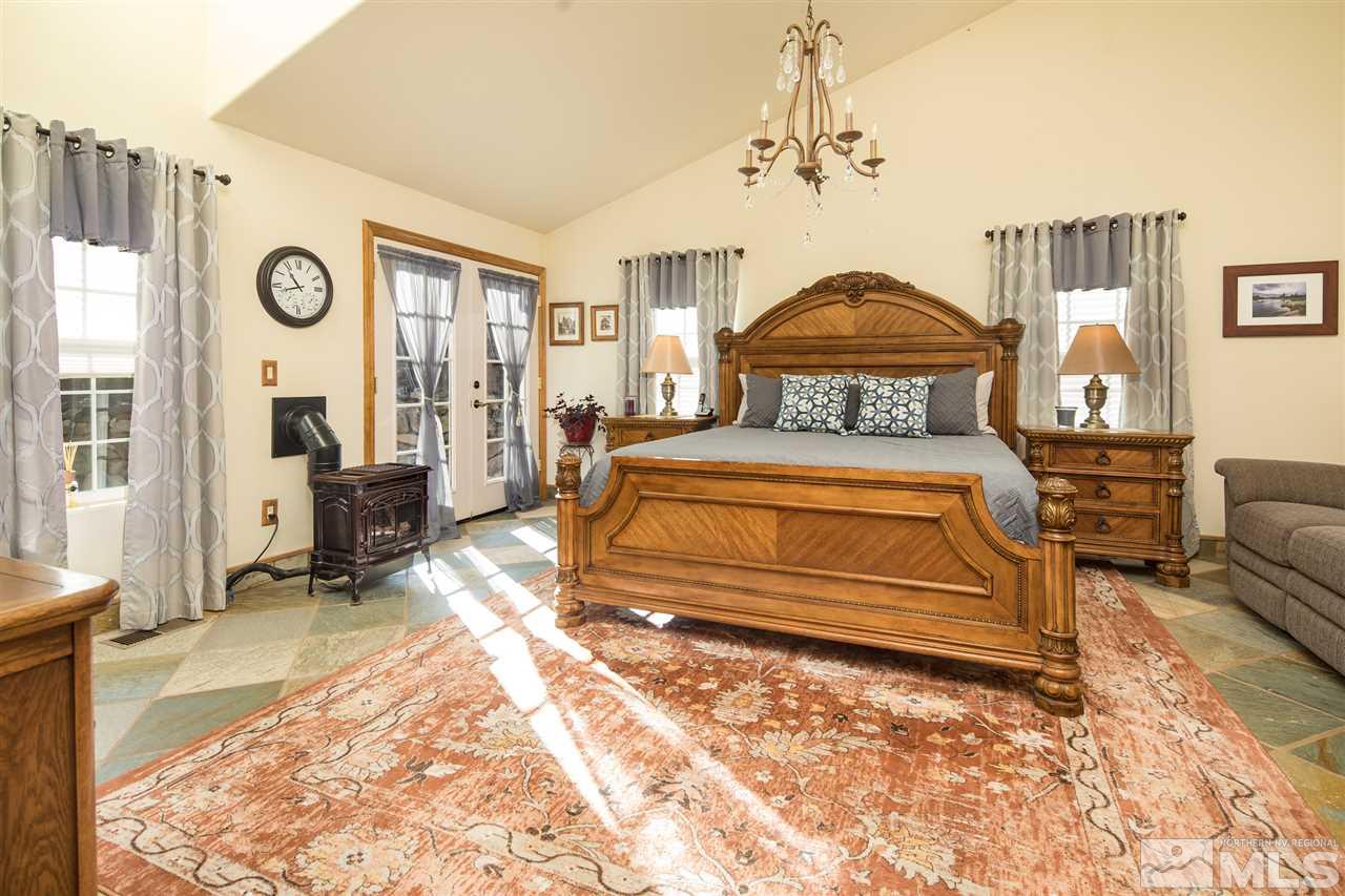100 Boron Lane Reno, NV 89506 - Photo 10 of 25 a bedroom with a bed a couch and dresser