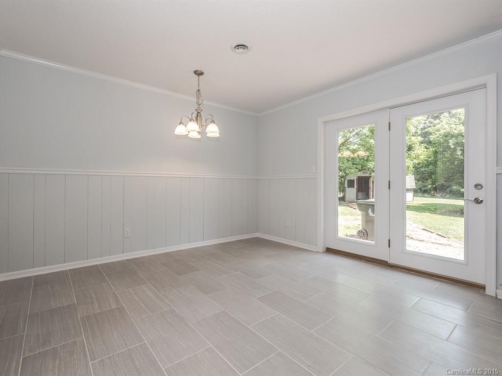 2314 Goldmine Road Monroe, NC 28110 - Photo 11 of 24 an empty room with windows and entrance