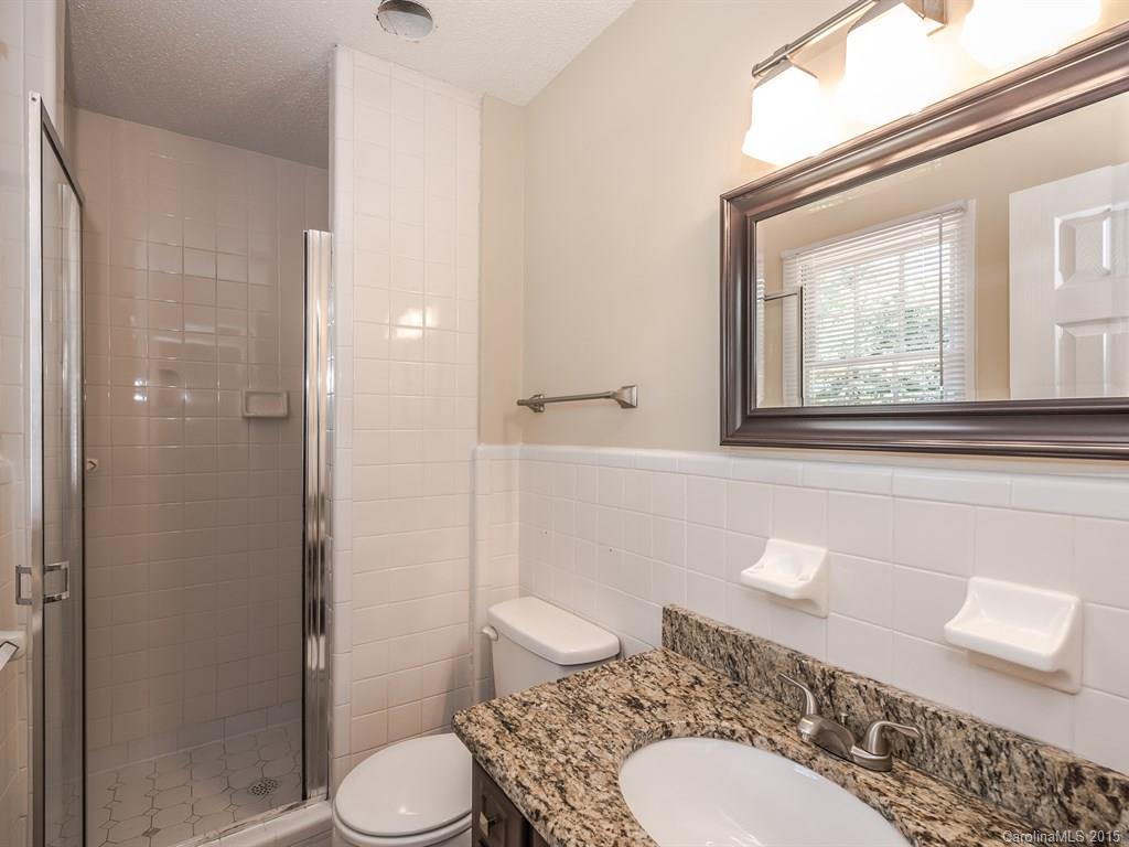 2314 Goldmine Road Monroe, NC 28110 - Photo 16 of 24 a bathroom with a sink a toilet and shower