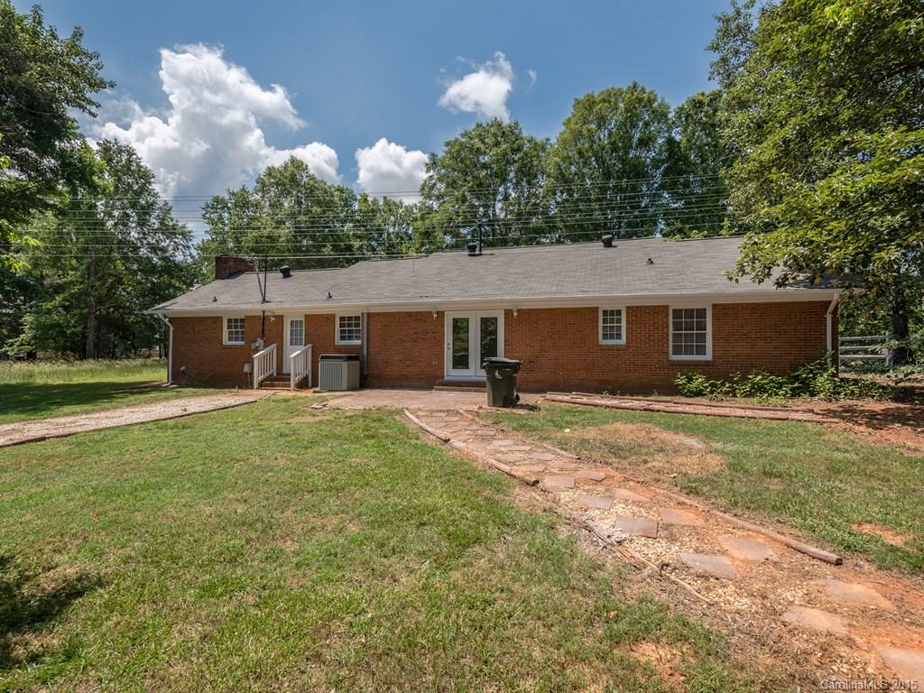 2314 Goldmine Road Monroe, NC 28110 - Photo 23 of 24 a front view of a house with a garden