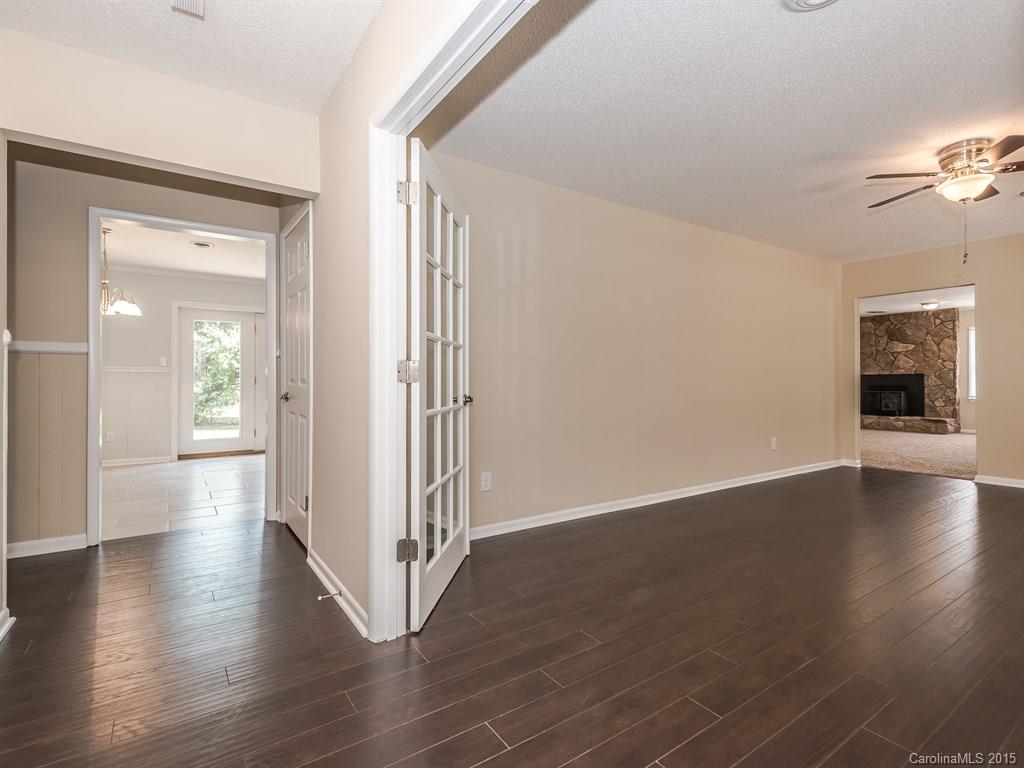 2314 Goldmine Road Monroe, NC 28110 - Photo 5 of 24 an empty room with wooden floor and windows