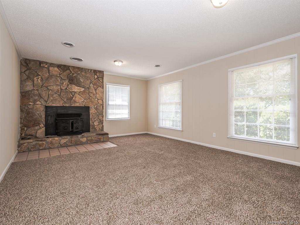 2314 Goldmine Road Monroe, NC 28110 - Photo 8 of 24 a view of empty room with a fireplace