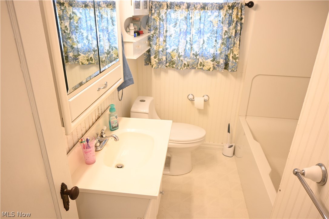 94 North 5th Street Rittman, OH 44270 - Photo 10 of 27 Full bath with vanity and toilet