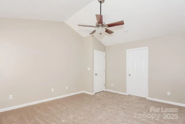 a view of a chandelier fan in a room