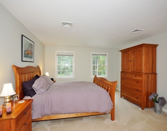 420 Depot Road Boxborough, MA 01719 - Photo 17 of 30 a bedroom with a bed a dresser and a window