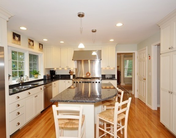420 Depot Road Boxborough, MA 01719 - Photo 9 of 30 a kitchen with stainless steel appliances granite countertop a sink a stove a refrigerator cabinets and living room view