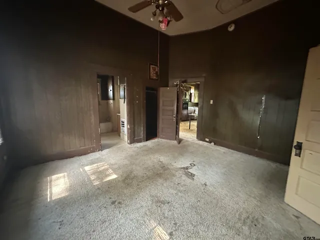 a view of a room with wooden ceiling