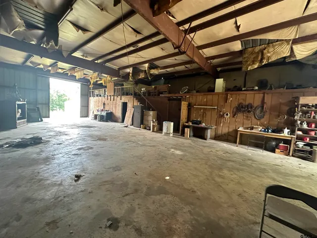 a view of a garden with wooden fence