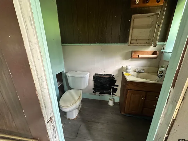 a view of an empty room with a fireplace