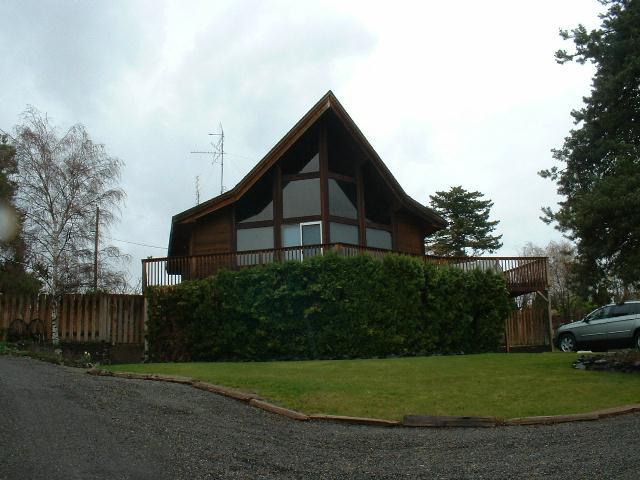 51 Sand Hill Road Grandview, WA 98930 - Photo 1 of 7 a view of a house with backyard and trees