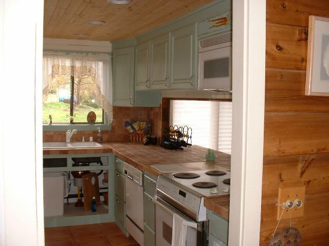 51 Sand Hill Road Grandview, WA 98930 - Photo 3 of 7 a kitchen with a stove a sink and a microwave