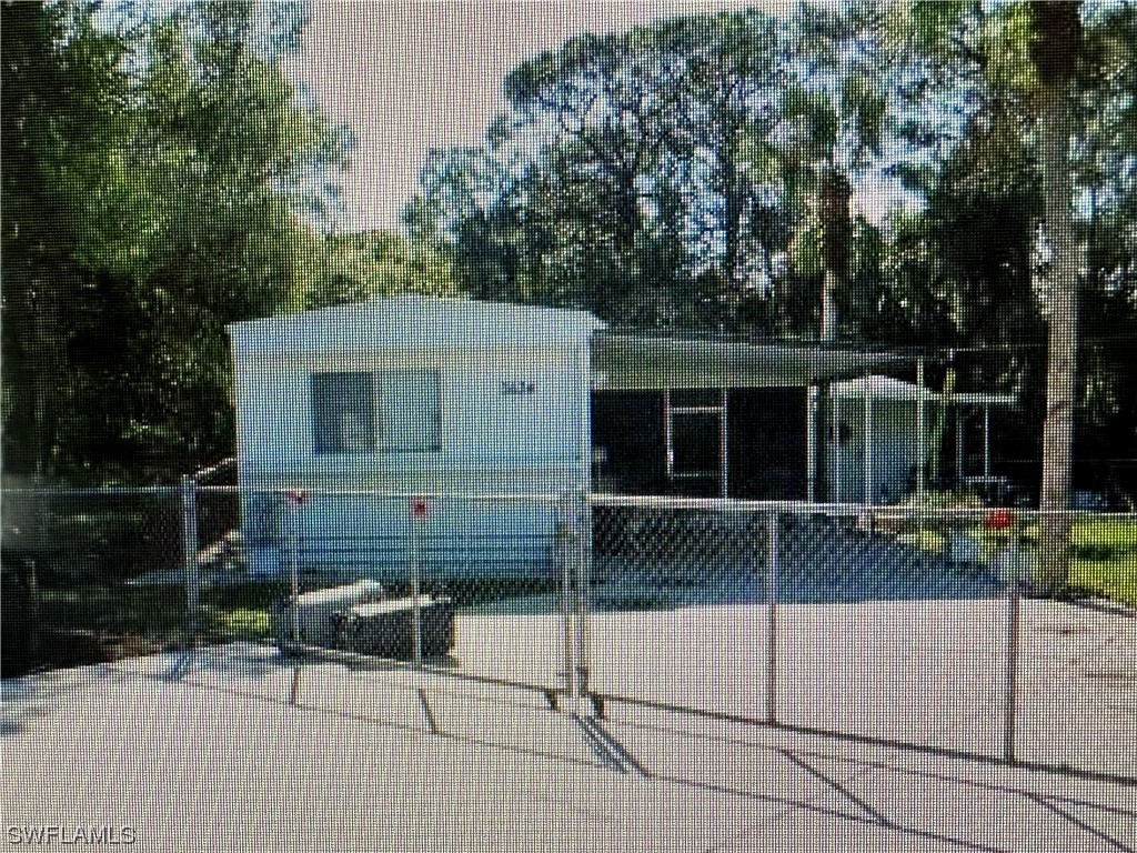 3634 Unique Circle Fort Myers, FL 33908 - Photo 1 of 10 a view of a house with backyard and sitting area
