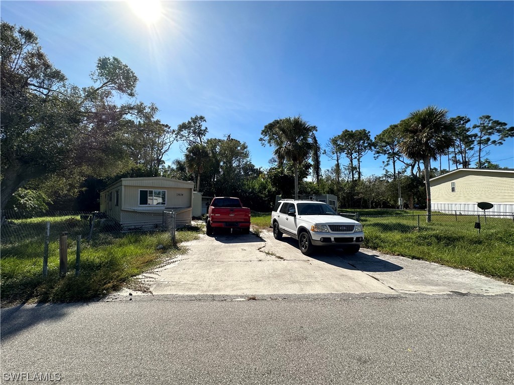 3634 Unique Circle Fort Myers, FL 33908 - Photo 2 of 10 a car parked on the side of the road