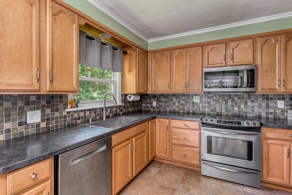 1929 Allen Street Springfield, MA 01118 - Photo 14 of 38 a kitchen with granite countertop a sink stainless steel appliances and cabinets