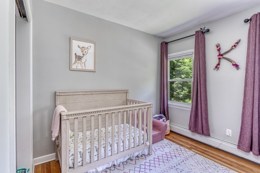 1929 Allen Street Springfield, MA 01118 - Photo 17 of 38 a bedroom with a bed and a window