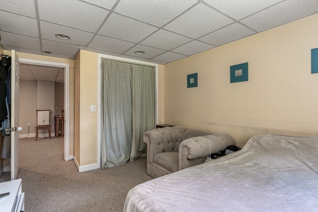 1929 Allen Street Springfield, MA 01118 - Photo 27 of 38 a bedroom with bed and a couch