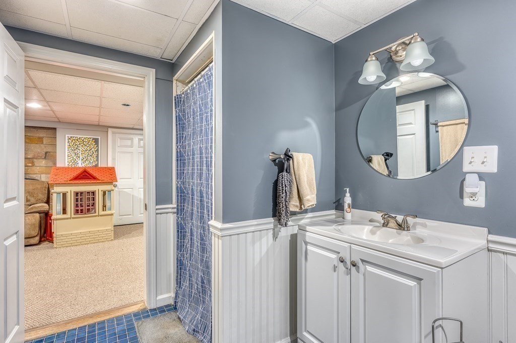 1929 Allen Street Springfield, MA 01118 - Photo 29 of 38 a bathroom with a sink and a mirror