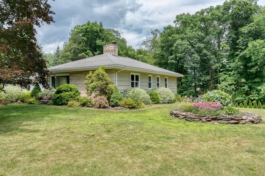 1929 Allen Street Springfield, MA 01118 - Photo 3 of 38 a front view of a house with a garden