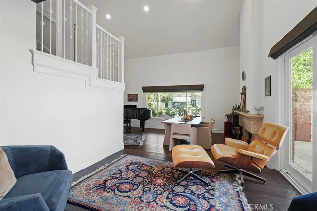 a living room with furniture and a rug