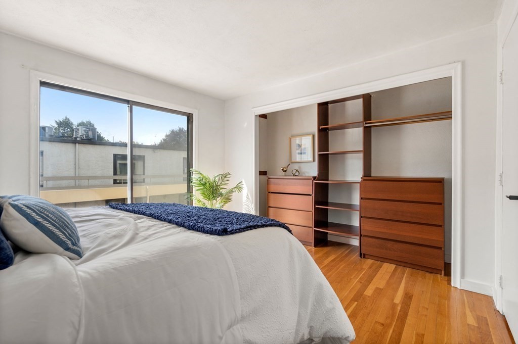 120 Beaconsfield Road, Unit 12 Brookline, MA 02445 - Photo 21 of 32 a bedroom with a bed and a window