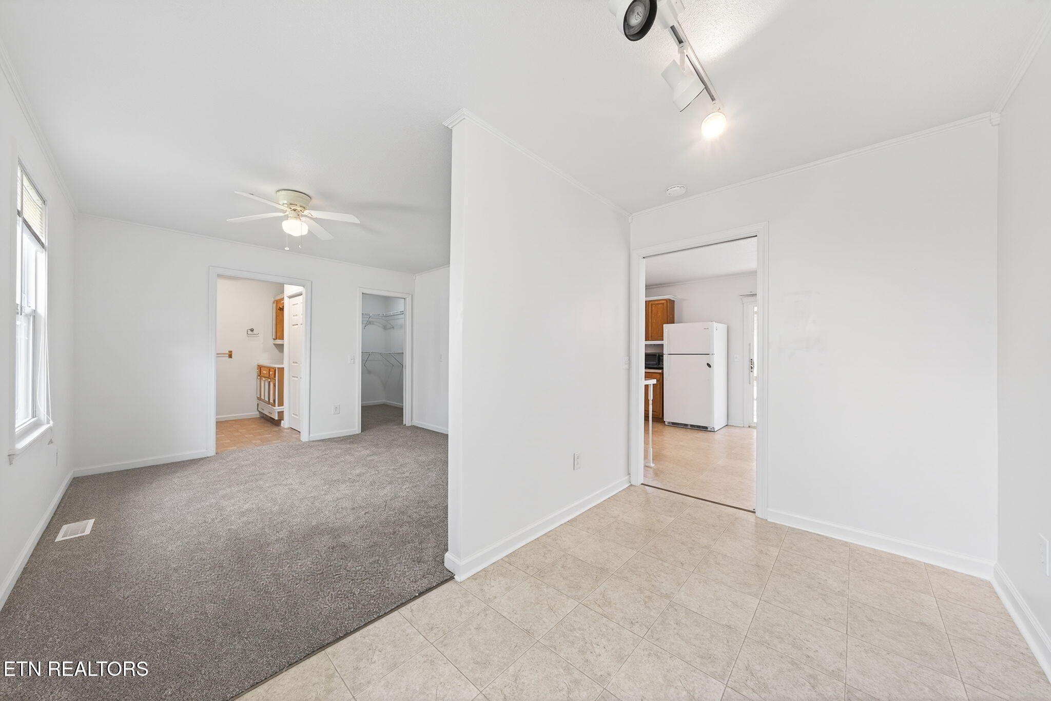 4067 Blaylock Road Crossville, TN 38572 - Photo 10 of 17 an empty room with an entryway and kitchen view