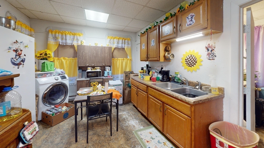 51 Uxbridge Street Worcester, MA 01605 - Photo 14 of 33 a kitchen with a refrigerator and a stove
