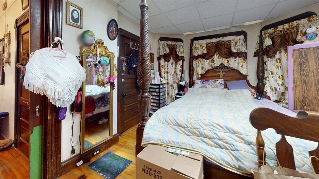 51 Uxbridge Street Worcester, MA 01605 - Photo 15 of 33 a bed room with a bed and a desk