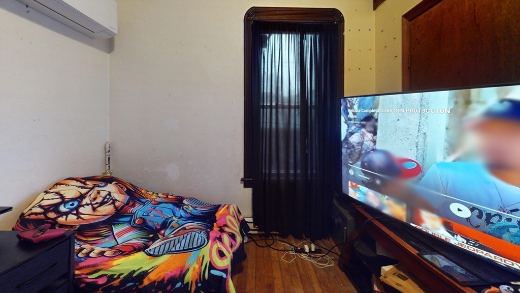 51 Uxbridge Street Worcester, MA 01605 - Photo 16 of 33 a bedroom with a bed and a window