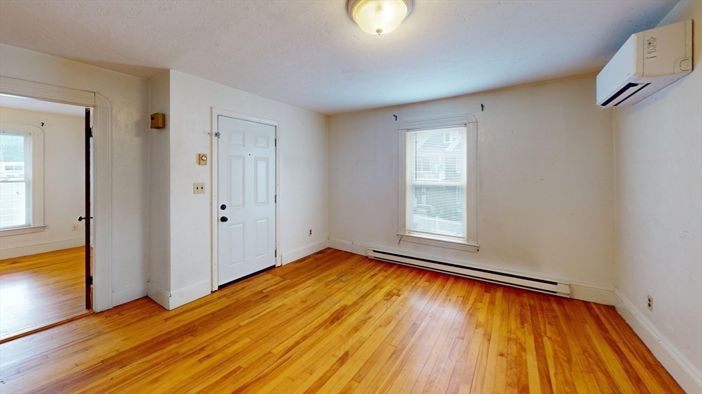 51 Uxbridge Street Worcester, MA 01605 - Photo 19 of 33 a view of empty room with wooden floor and fan