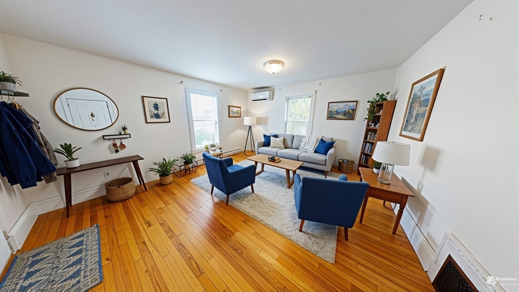 51 Uxbridge Street Worcester, MA 01605 - Photo 20 of 33 a living room with furniture and wooden floor