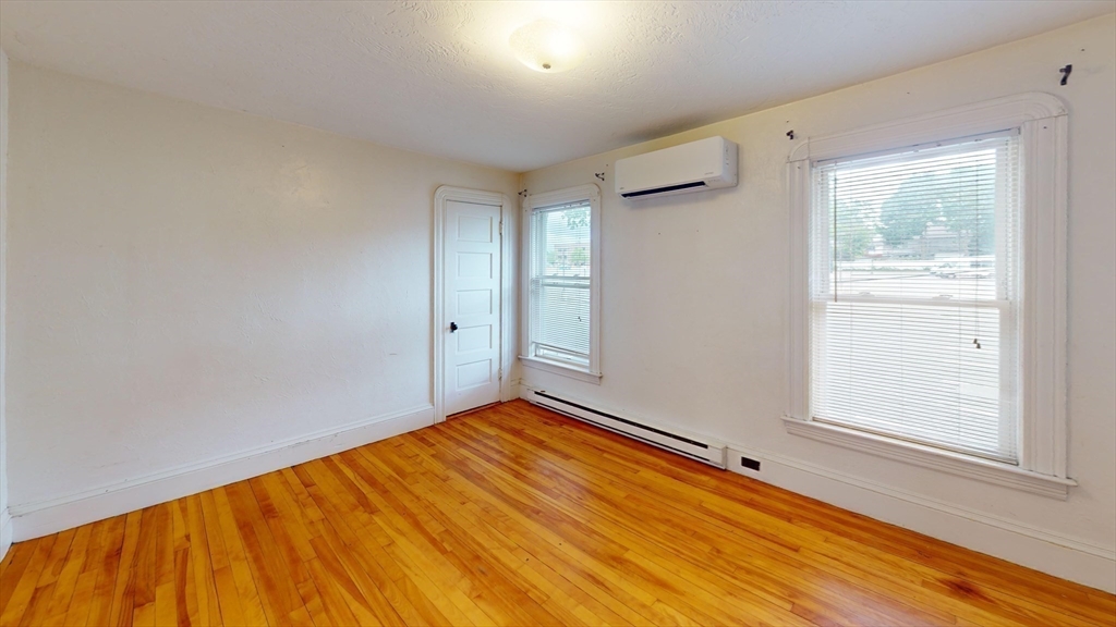 51 Uxbridge Street Worcester, MA 01605 - Photo 21 of 33 a view of room with window and wooden floor
