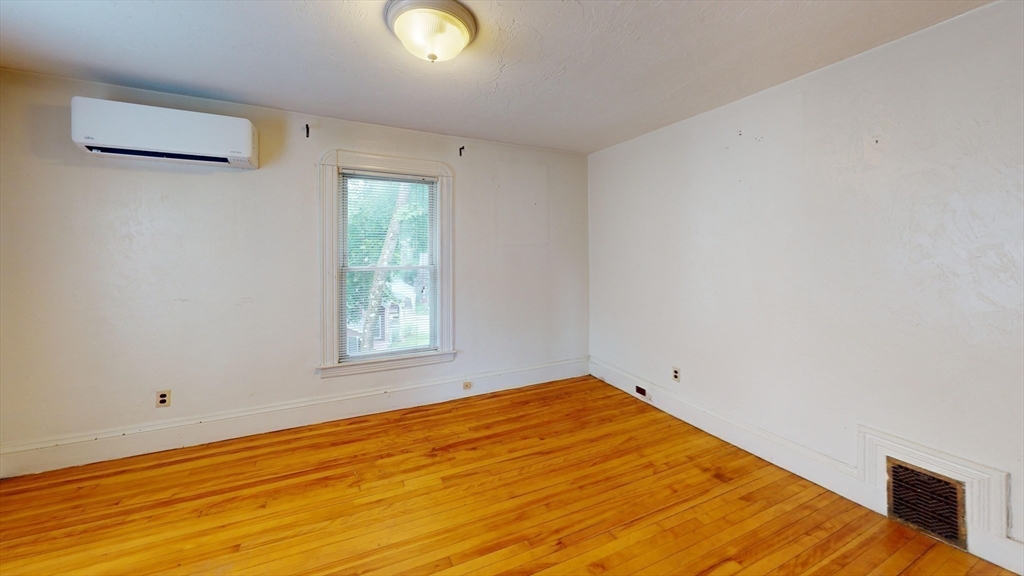 51 Uxbridge Street Worcester, MA 01605 - Photo 22 of 33 a view of empty room with wooden floor
