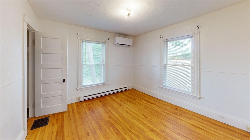 51 Uxbridge Street Worcester, MA 01605 - Photo 23 of 33 a view of empty room with wooden floor and fan