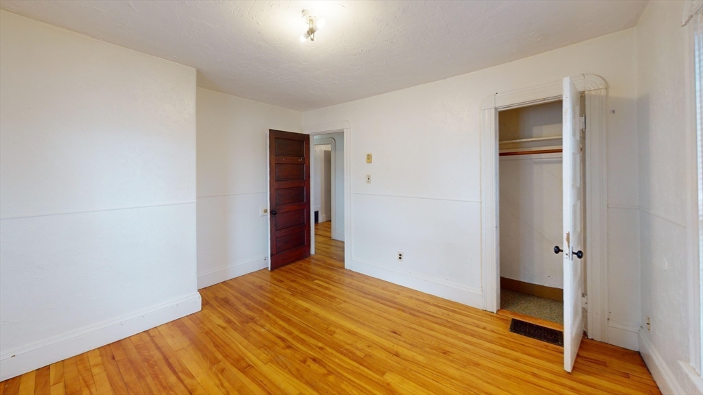51 Uxbridge Street Worcester, MA 01605 - Photo 25 of 33 a view of empty room with wooden floor
